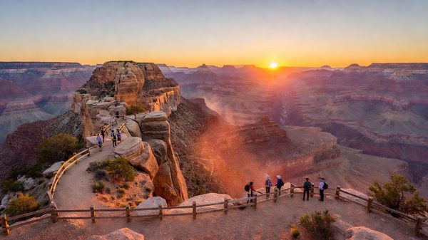 Grand Canyon South Rim at sunrise, layered red and orange rock strata