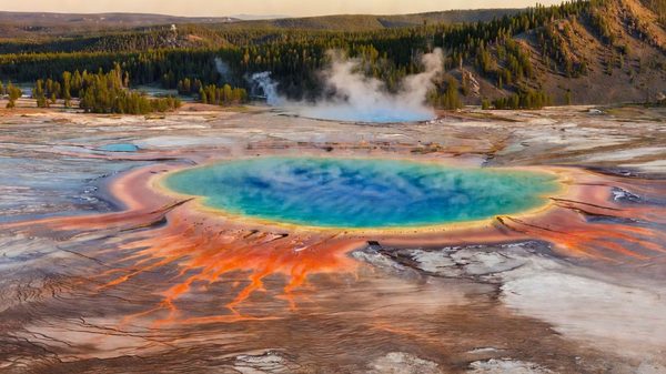 Grand Prismatic Spring's vivid rings of color viewed from the Fairy Falls overlook trail, steam rising above Yellowstone's Midway Geyser Basin